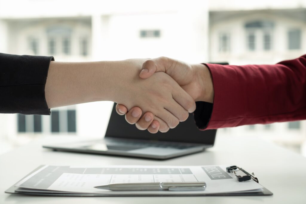Employer shake hand with job applicant congratulates welcome new hires after successful negotiations